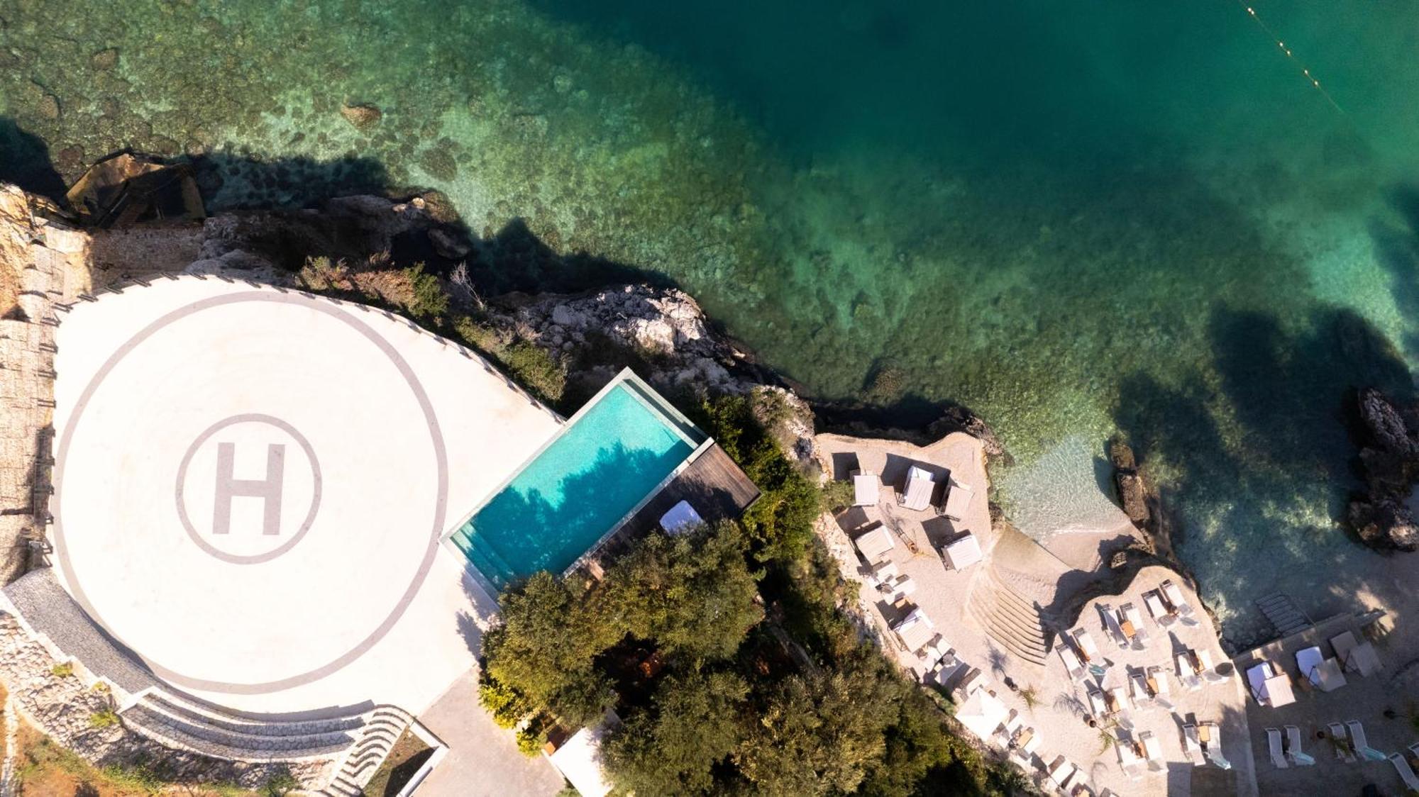 Maritim Marina Bay Resort Spa & Casino Adult Friendly Vlore Exterior photo Aerial view of the pool